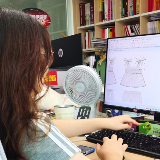 Kidswear factory designer creating new children's clothing styles for Australian & New Zealand buyers